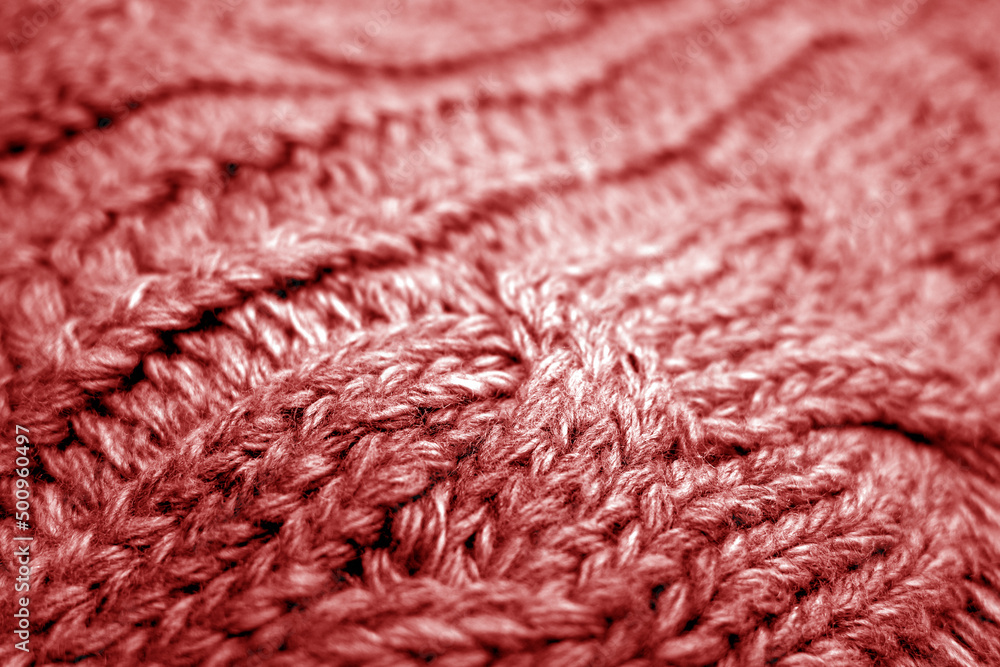 Warm knitting texture with blur effect in red tone. Warm knitting texture with blur effect in red tone.