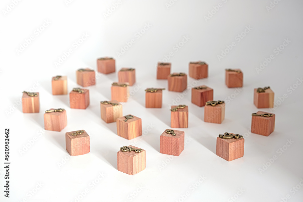Bronze ornamental keys on Wooden toy cubes on white background Bronze ornamental keys on Wooden toy cubes on white background