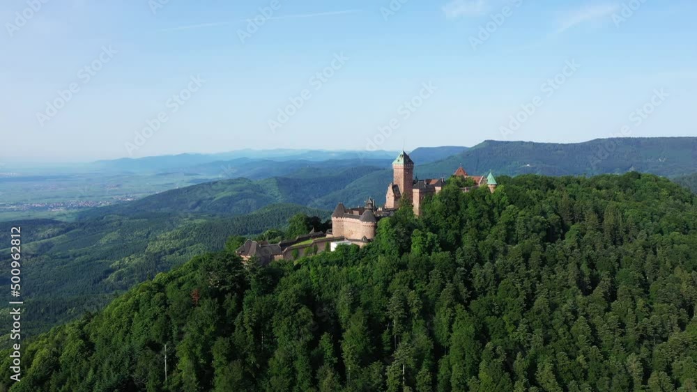 Haut-Koenigsbourg Castle in the forest and green countryside , in Europe, France, Alsace, Bas Rhin, towards Strasbourg, in summer, on a sunny day. Haut-Koenigsbourg Castle in the forest and green countryside , in Europe, France, Alsace, Bas Rhin, towards Strasbourg, in summer, on a sunny day.