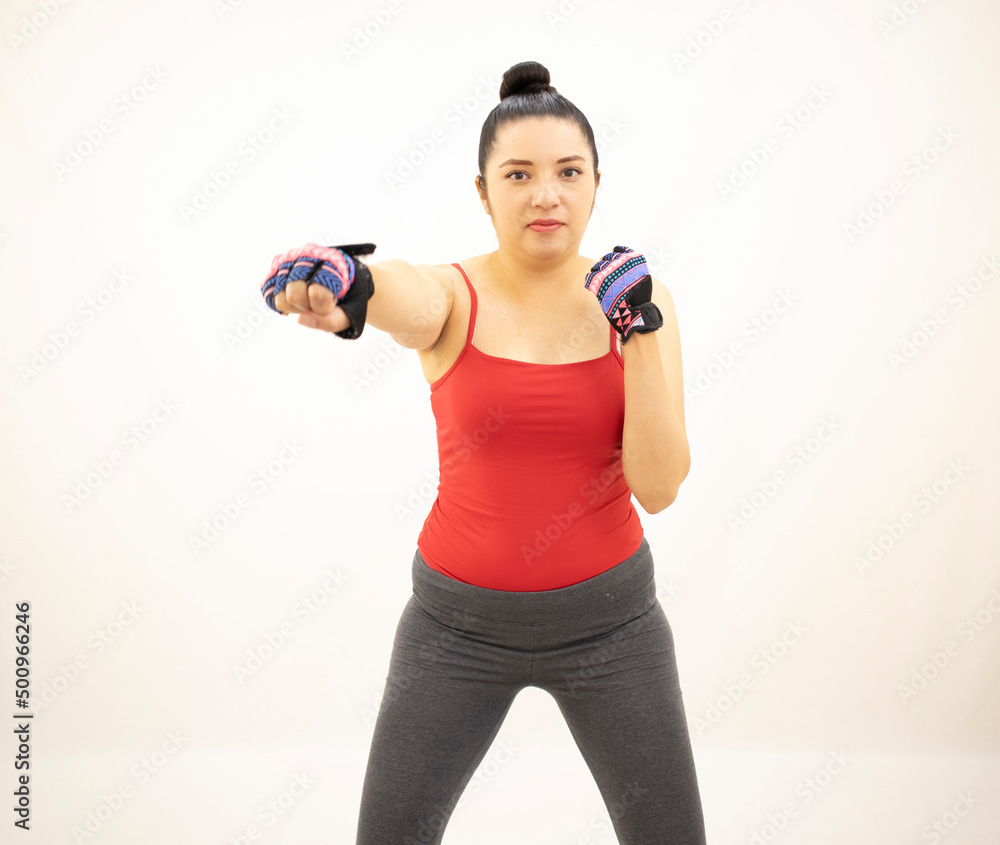 woman exercising cloth red and gray, gloves with with white background woman exercising cloth red and gray, gloves with with white background