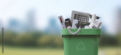 Waste bin full of e-waste photo