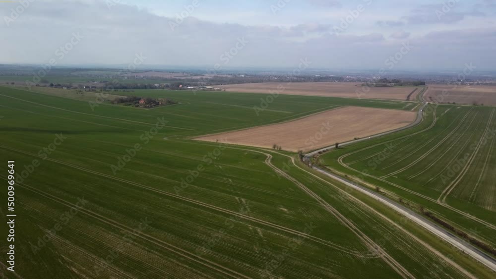 Slow flight over fields of newly planted wheat in early Spring Slow flight over fields of newly planted wheat in early Spring