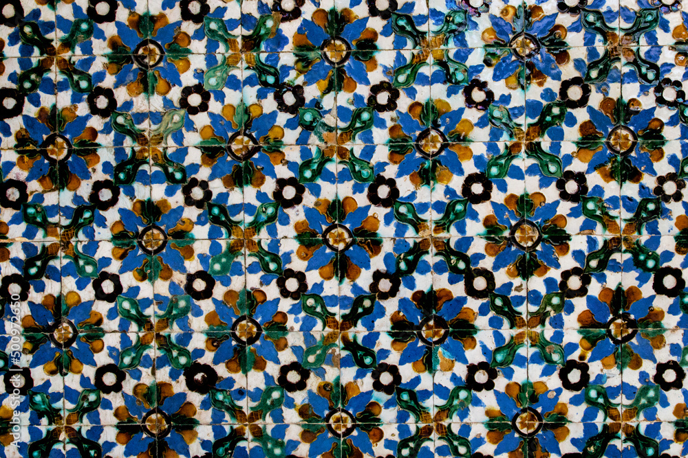 Traditional tiled wall decoration in a city palace in Seville, Spain.