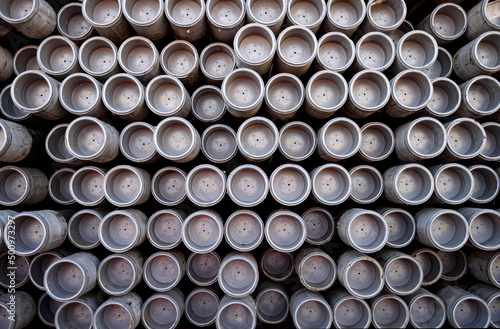 Canvas Print Close up full frame view of rows of stacked oil and gas industry iron metal dril