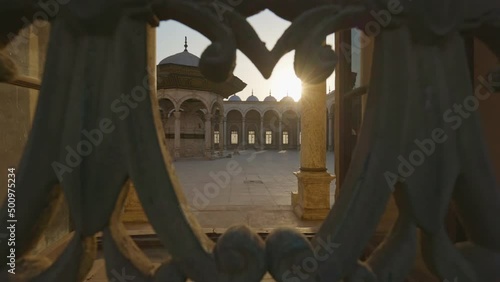 Sun breaks through the lattice of window in the mosque Muhammad Ali Pasha, courtyard is visible inside. Great Mosque of Muhammad Ali Pasha or Alabaster Mosque in Cairo, Egypt. Citadel of Cairo. Gimbal photo