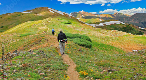 Hikers walking along the Continental Divide above 12,000 feet near Colorado's Loveland Pass photo