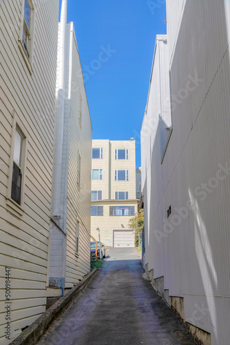 Uphill alleyway in the middle of flat residential buildings in San Francisco, California