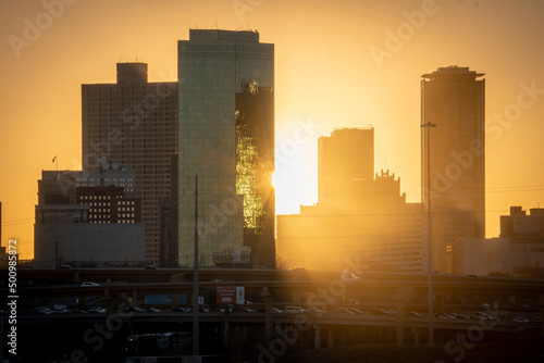 Fort Worth  TX USA - March 19  2022  Sun setting behind towers in Downtown Fort Worth