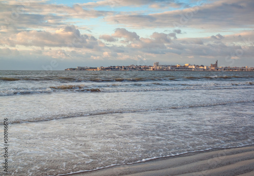 Sea waves on beach on the coast of Charente Maritime, France photo