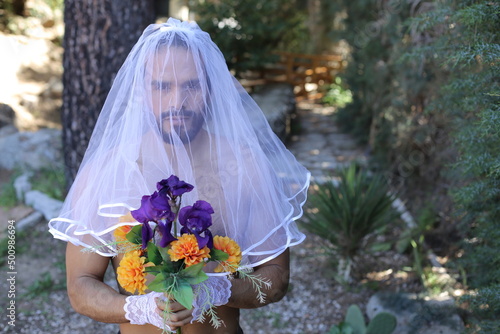 Proud gender fluid man representing diversity in bridal shoot 