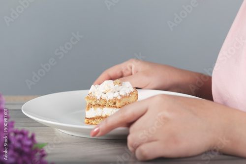 woman eat cake and drink coffee and lilac