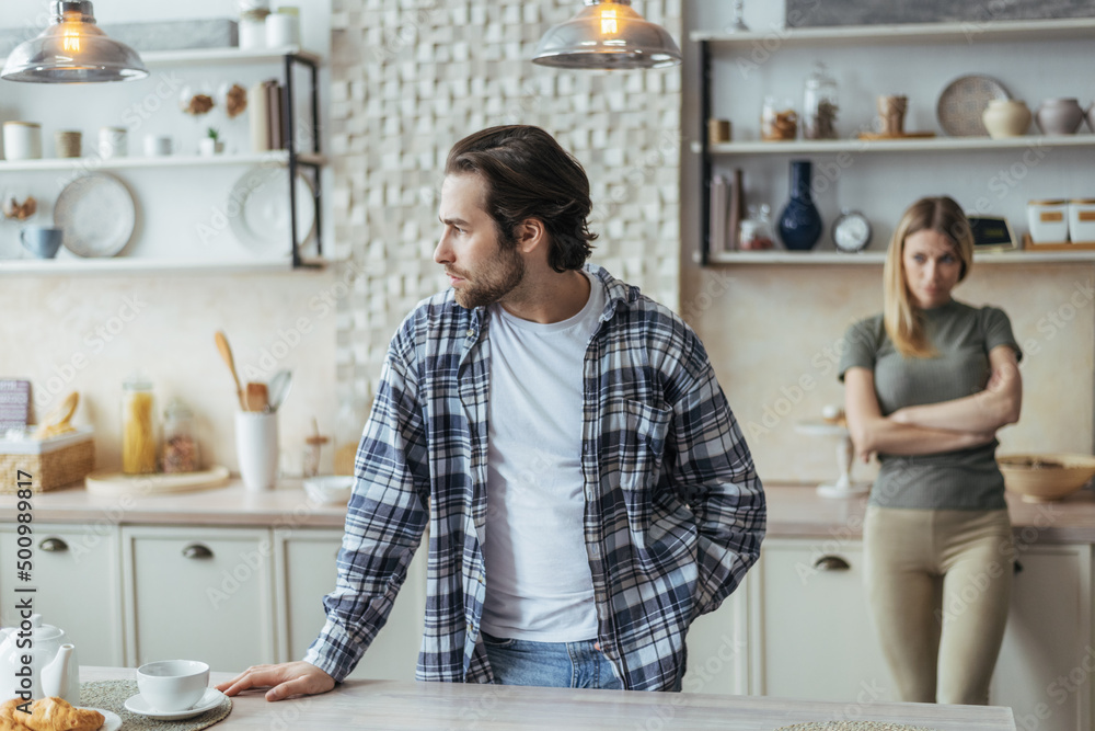 Ταπετσαρία Sad unhappy young european husband with stubble ignores offended wife after scan