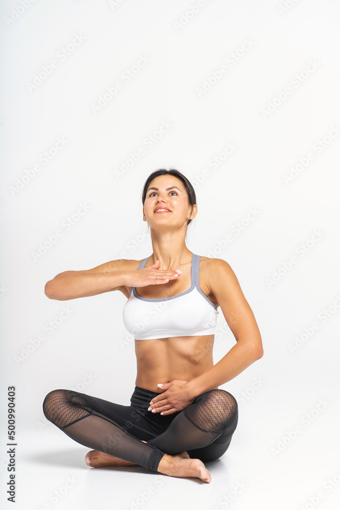 Breathing practices, yoga and Pilates. Photo of a young athletic woman.