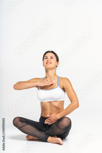 Breathing practices, yoga and Pilates. Photo of a young athletic woman.