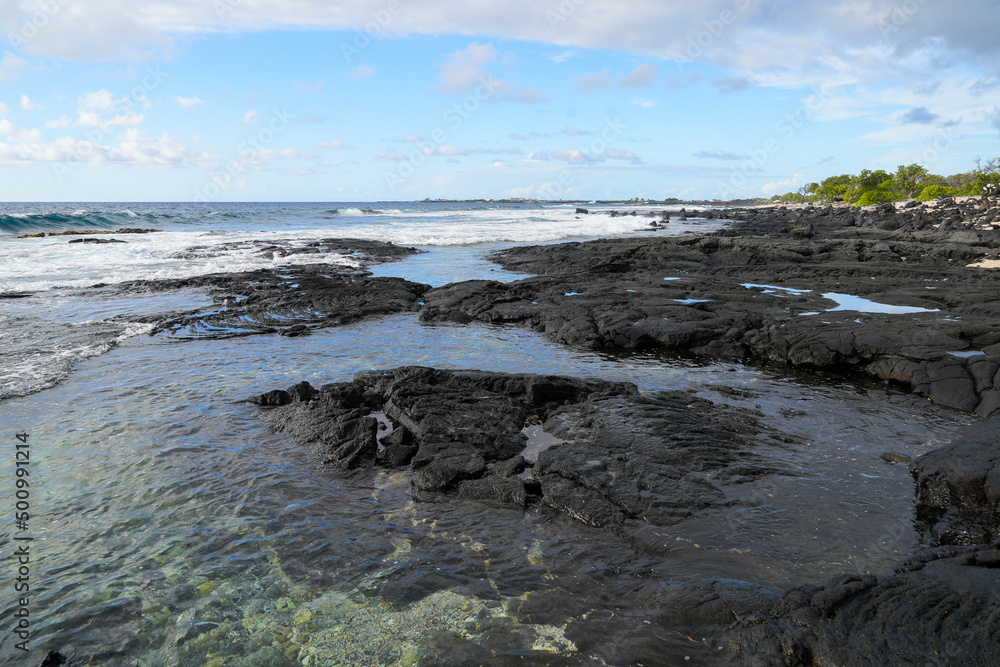 Solidified lava on the sandy O'oma Beach near Kailua-Kona in the west of Big Island in Hawaii, United States - Favorite getaway location among locals