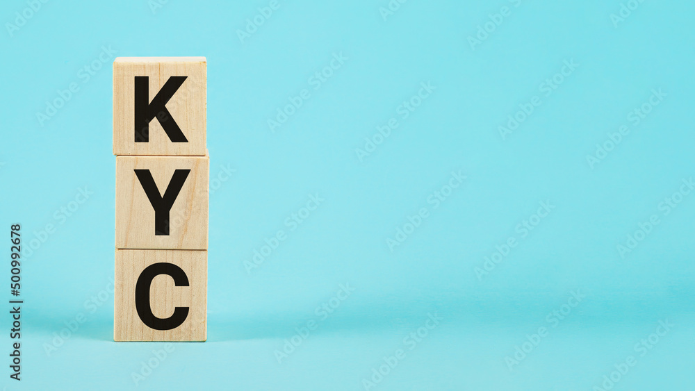 KYC - Know Your Customer. Wooden blocks with text KYC. You can u KYC - Know Your Customer. Wooden blocks with text KYC. You can u