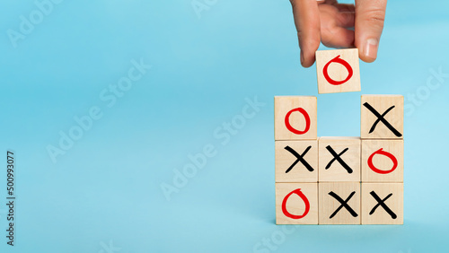 Wooden block tic tac toe board game. Business marketing strategy