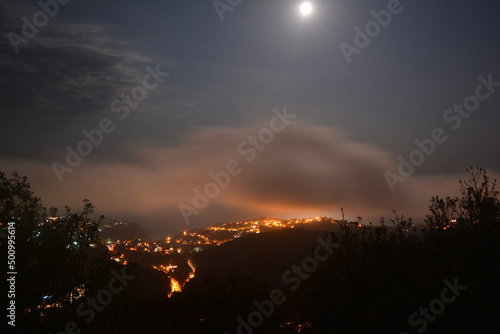 Fotobehang Seaview by Night and fullmoon on the Costa Brava, with sea bay Cala Canyelles near Lloret de Mar