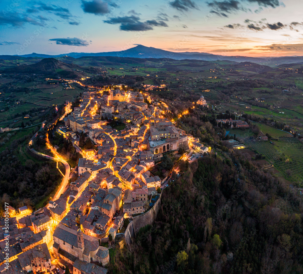 High resolution blue hour aerial image of the illuminated medieval town Montepulciano in Tuscany, Italy
