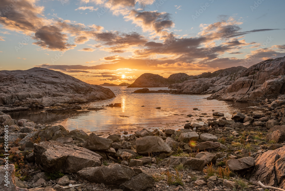 Golden sunset over a small bay.