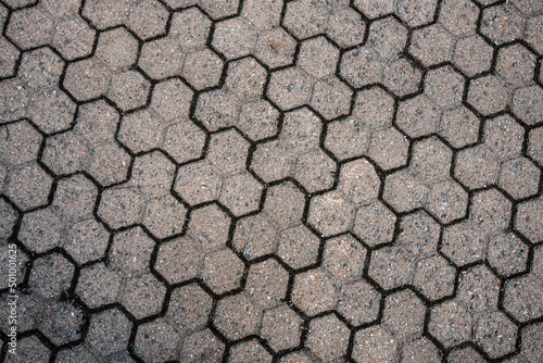 Pattern of triple hexagonal stone floor tiles.