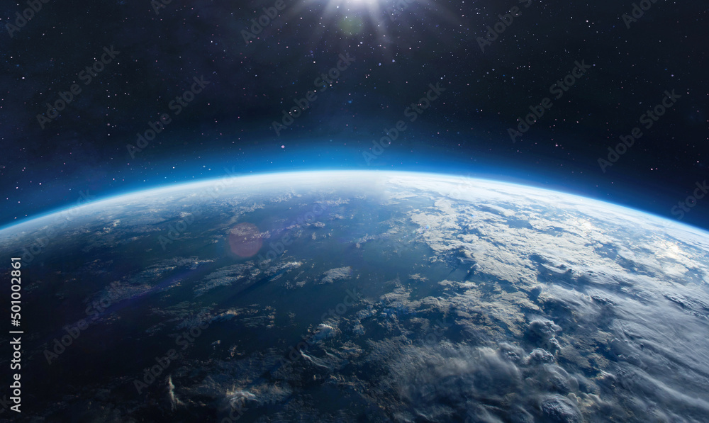 Earth surface view from orbit in space. Blue planet. Clouds and sky on horizon. Elements of this image furnished by NASA