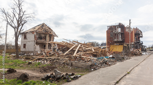 War in Ukraine. Destroyed houses in the village of Makariv photo