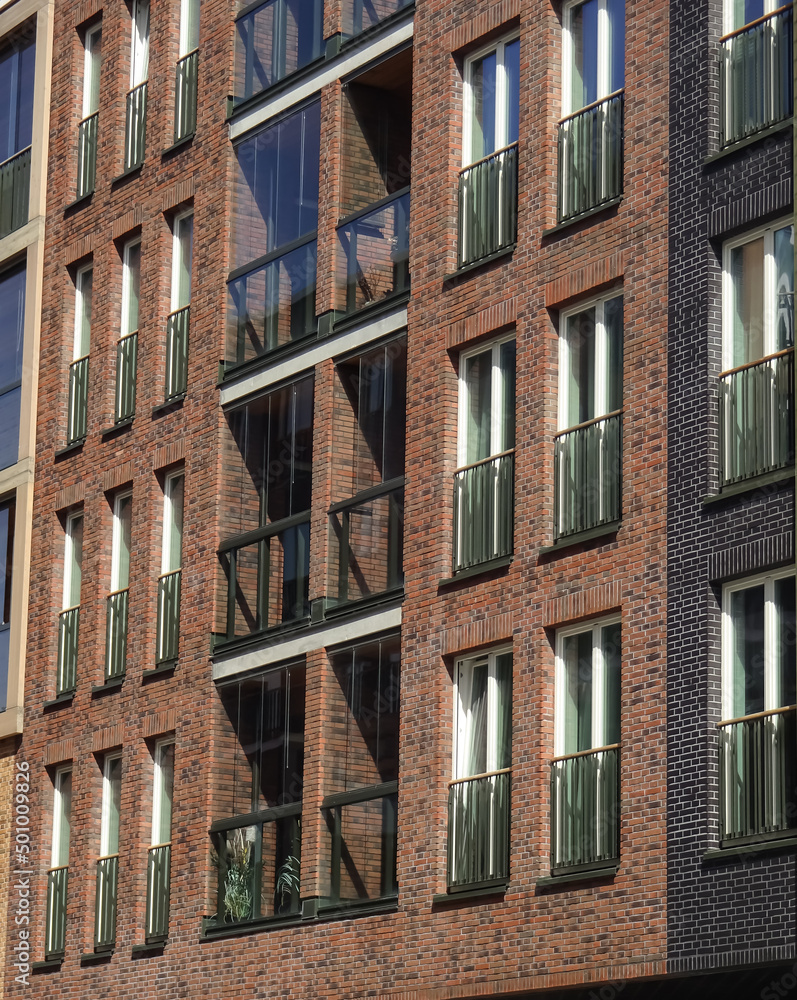 Obraz premium Close up of new modern building brick facade with brown blocks in Noblessner district. Tallinn, Estonia, Europe. April 2022