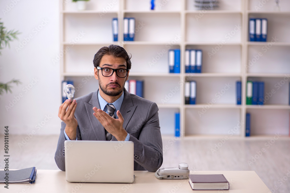 Young male employee in happy idea concept Young male employee in happy idea concept
