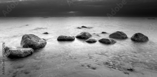 Stones on the beach. Black and white photography.