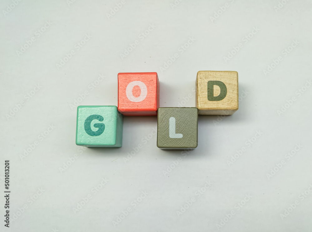a series of letters in a children's toy puzzle block into the word gold a series of letters in a children's toy puzzle block into the word gold
