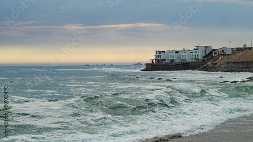 Pacific Ocean beach in Punta Hermosa, Lima, Peru with oceanside home