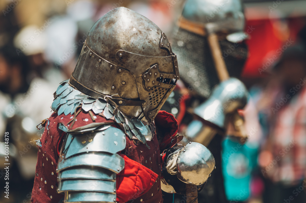 Pitch battle of medieval knights, using metal armor, axes, swords and shields to defend themselves. Pitch battle of medieval knights, using metal armor, axes, swords and shields to defend themselves.