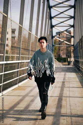 Portrait of a lesbian girl walking on the sidewalk photo