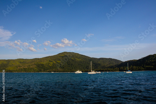 Boats  speedboats and sailboats in tropical and paradise landscape with blue sky of the coast of Ubatuba - Brazil