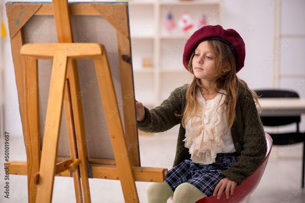 Young little girl enjoying painting at home Young little girl enjoying painting at home