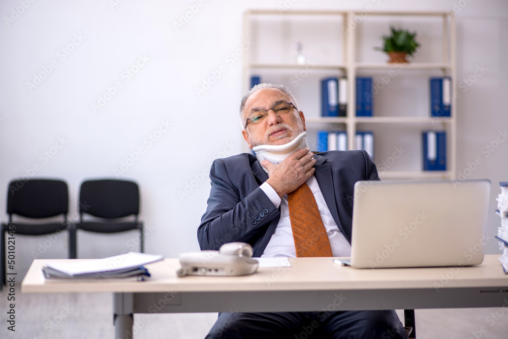 Old male employee after accident at workplace Old male employee after accident at workplace