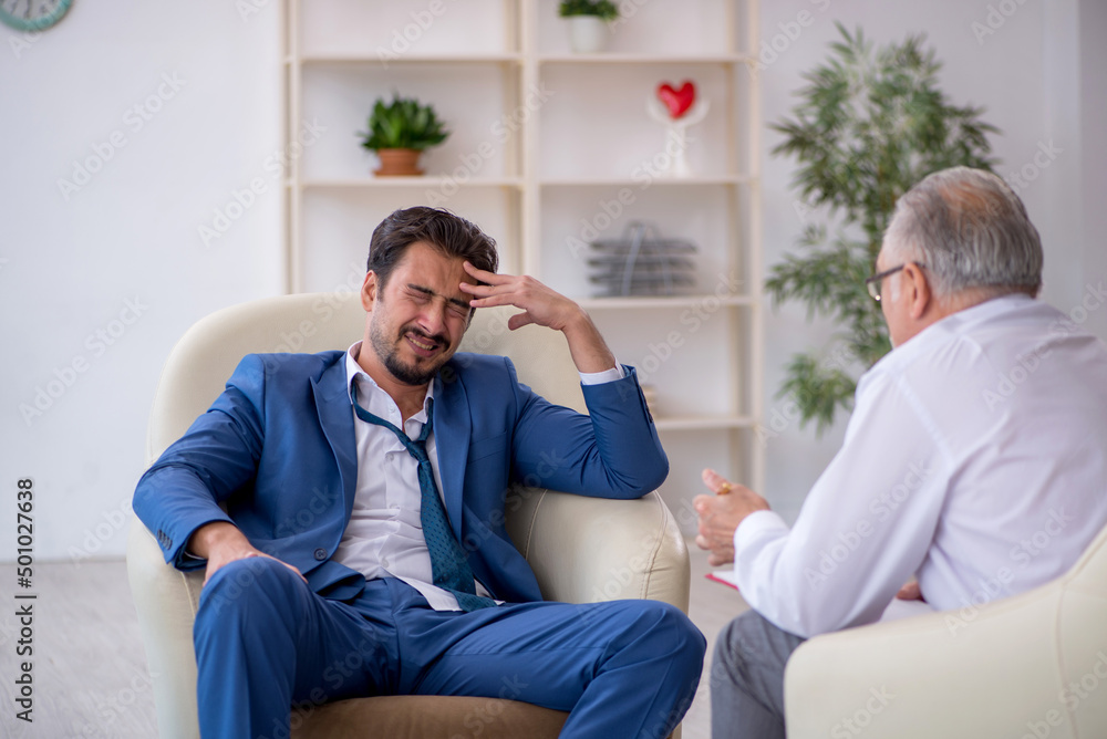 Young businessman employee visiting psychologist Young businessman employee visiting psychologist