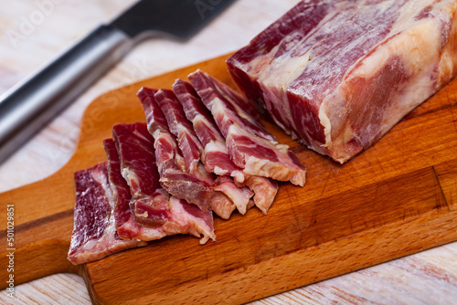 Traditional Spanish delicacy lacon curado - jerky pork ham. High quality photo