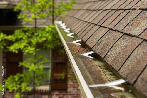 Slika na platnu Gutter on home overlfowing with water
