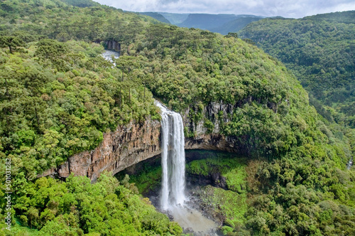 Caracol Falls, a 130 meters waterfall. It is formed by the Caracol River and cuts out of basalt cliffs in the Serra Geral Mountain range, zone of the Brazilian Highlands. Canela, Brazil, Dec 2019