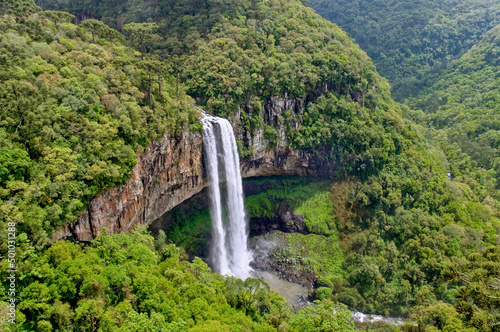 Caracol Falls  a 130 meters waterfall. It is formed by the Caracol River and cuts out of basalt cliffs in the Serra Geral Mountain range  zone of the Brazilian Highlands. Canela  Brazil  Dec 2019