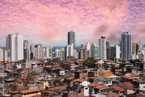 Urban social contrast. Buildings and slum. Inequality. © Gustavo