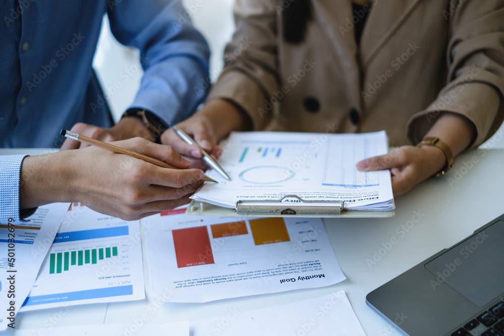 Consult financial concept. Business woman pointing at paperwork and using calculator. Consult financial concept. Business woman pointing at paperwork and using calculator.