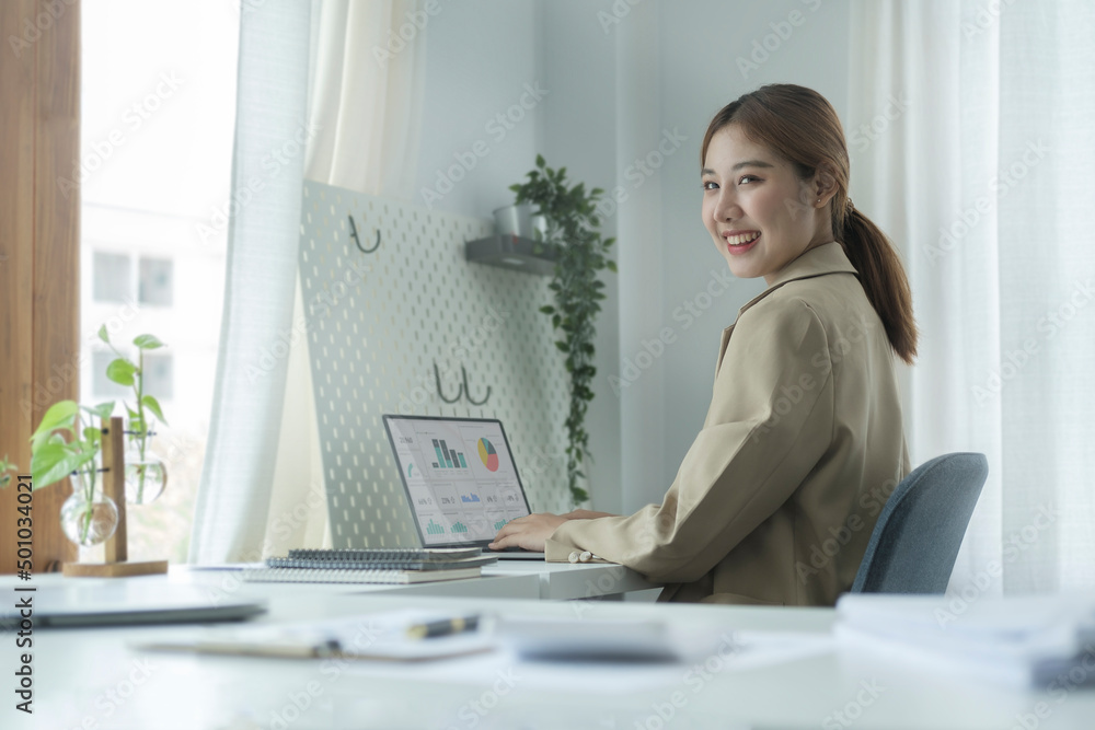 Side view young creative woman working at modern office. Side view young creative woman working at modern office.