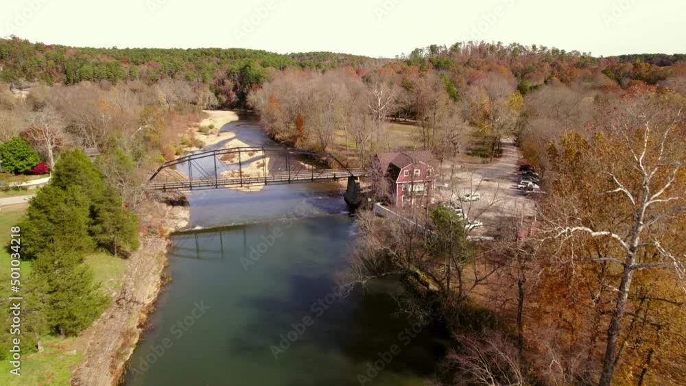 Aerial Forward Beautiful Shot Of Bridge Over River Amidst Landscape - Fayetteville, Arkansas Aerial Forward Beautiful Shot Of Bridge Over River Amidst Landscape - Fayetteville, Arkansas