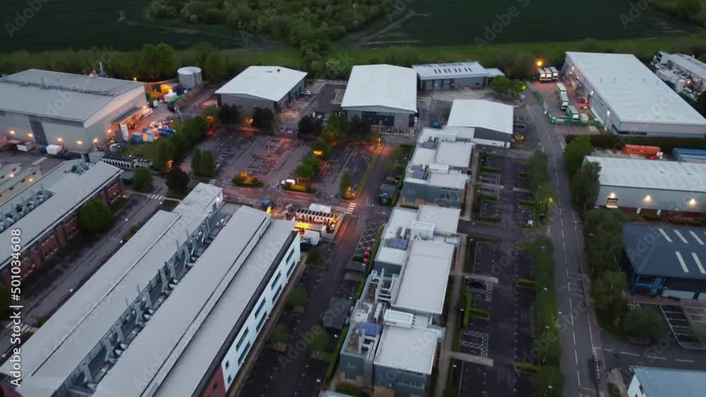 Reverse flight over a quiet business park at dusk Reverse flight over a quiet business park at dusk