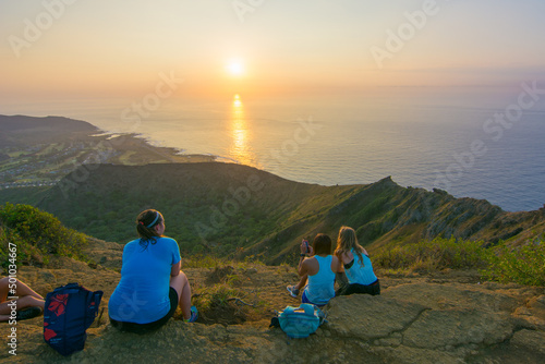 Tourists and locals enjoying a sunrise atop of Kokohead Crater in Honolulu on Oahu  Hawaii