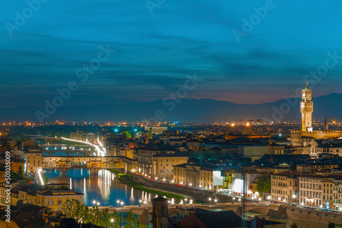 Florence city during sunset. Panoramic view to the river Arno, with Ponte Vecchio and Palazzo Vecchio , Florence, Italy