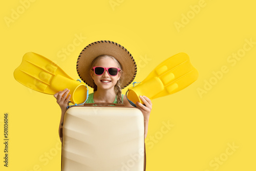 Cute little girl with suitc...